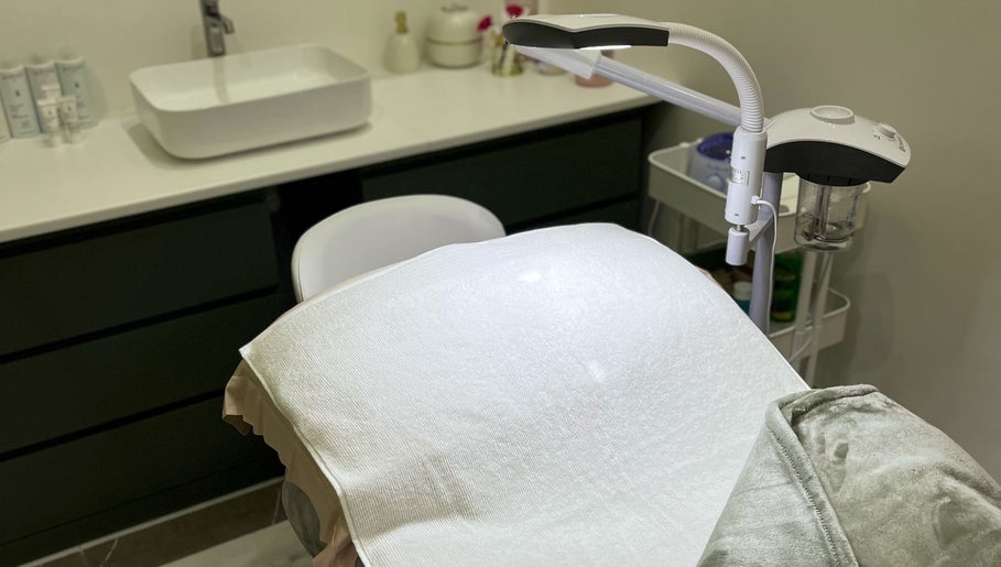 Treatment room at Facial Boutique by Anna, Doha, Doha Municipality, QA showcasing a spa bed and aesthetic tools.