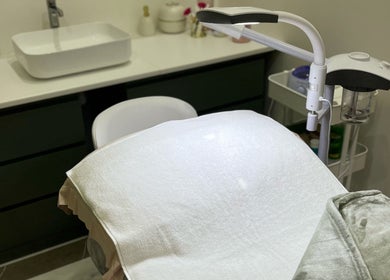 Treatment room at Facial Boutique by Anna, Doha, Doha Municipality, QA showcasing a spa bed and aesthetic tools.