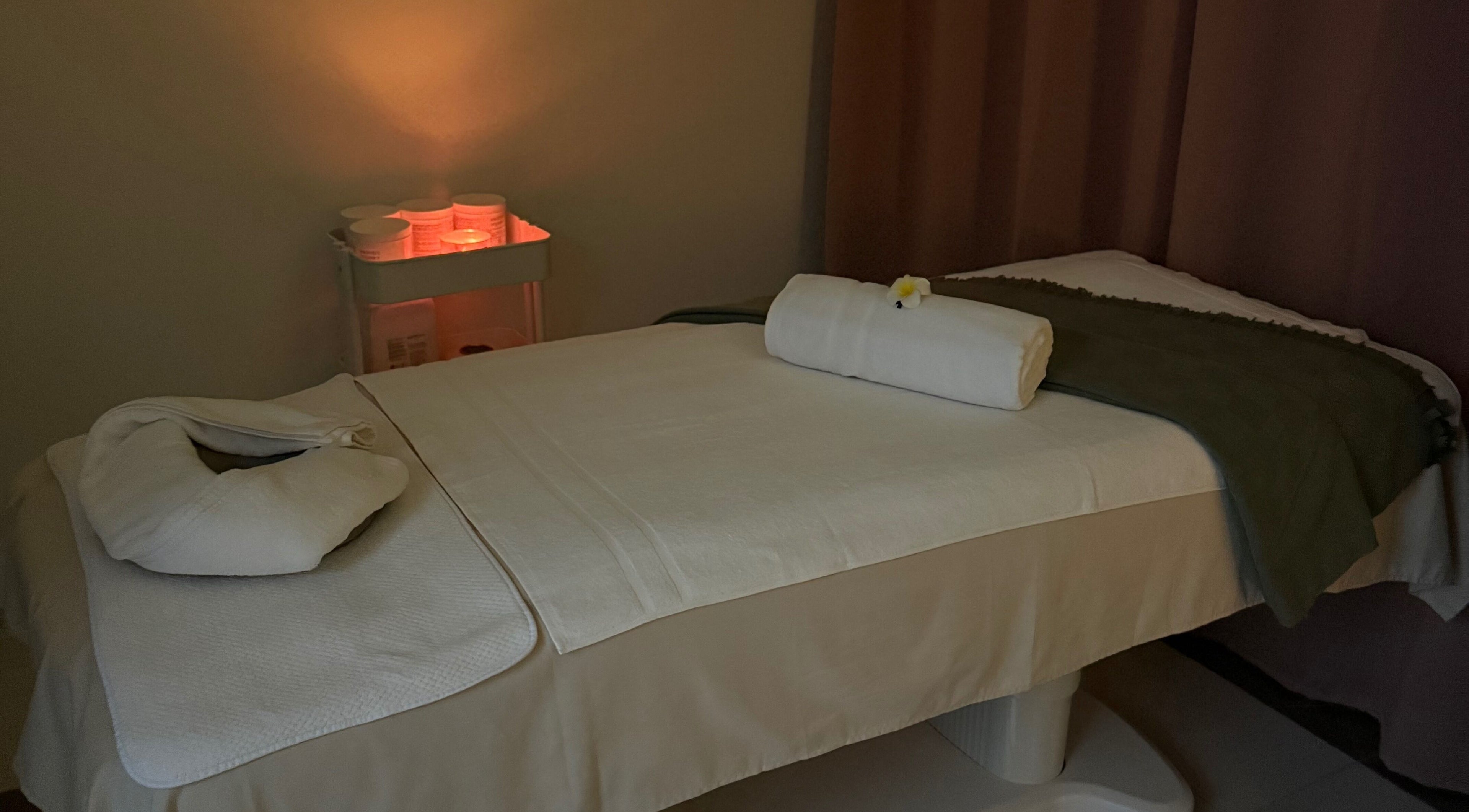 Serene treatment room at Facial Boutique by Anna in Doha, Doha Municipality, QA with cozy bed setup.