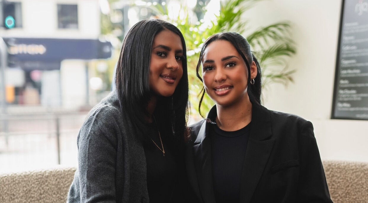 Smiling team members at BeauTee & Co, Sale, England, GB, showcasing a welcoming environment.