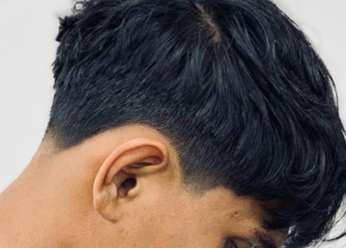 Close-up of a stylish haircut at THE CUT ONE, Klang, Selangor, MY. Perfect blend for modern styles.