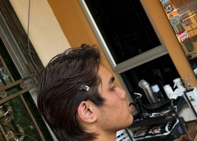 Side view of a haircut at THE CUT ONE, Klang, Selangor, MY showcasing sleek hairstyling.