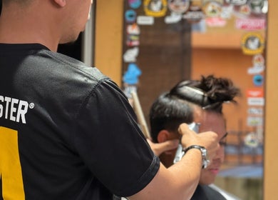 Professional barber at THE CUT ONE in Klang, Selangor, MY giving a precise haircut.