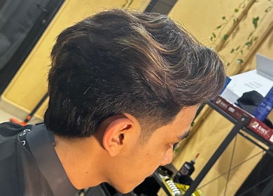Fresh haircut at THE CUT ONE, Klang, Selangor, MY, showcasing expertly styled hair in a modern finish.