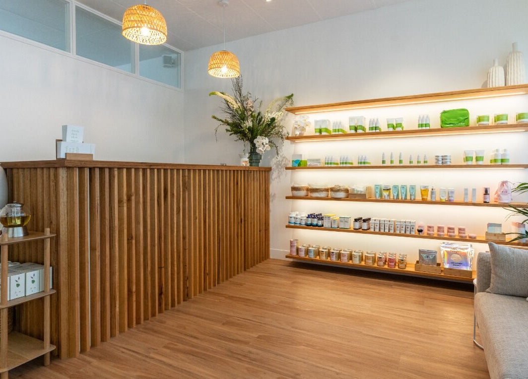 Welcoming reception area of Fresh Face Skin in Melbourne, Victoria, AU, with wooden decor and skincare products.