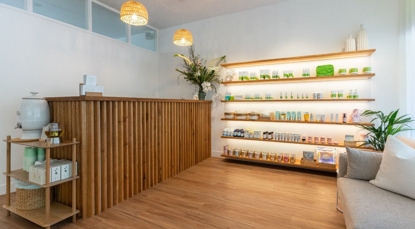 Welcoming reception area of Fresh Face Skin in Melbourne, Victoria, AU, with wooden decor and skincare products.