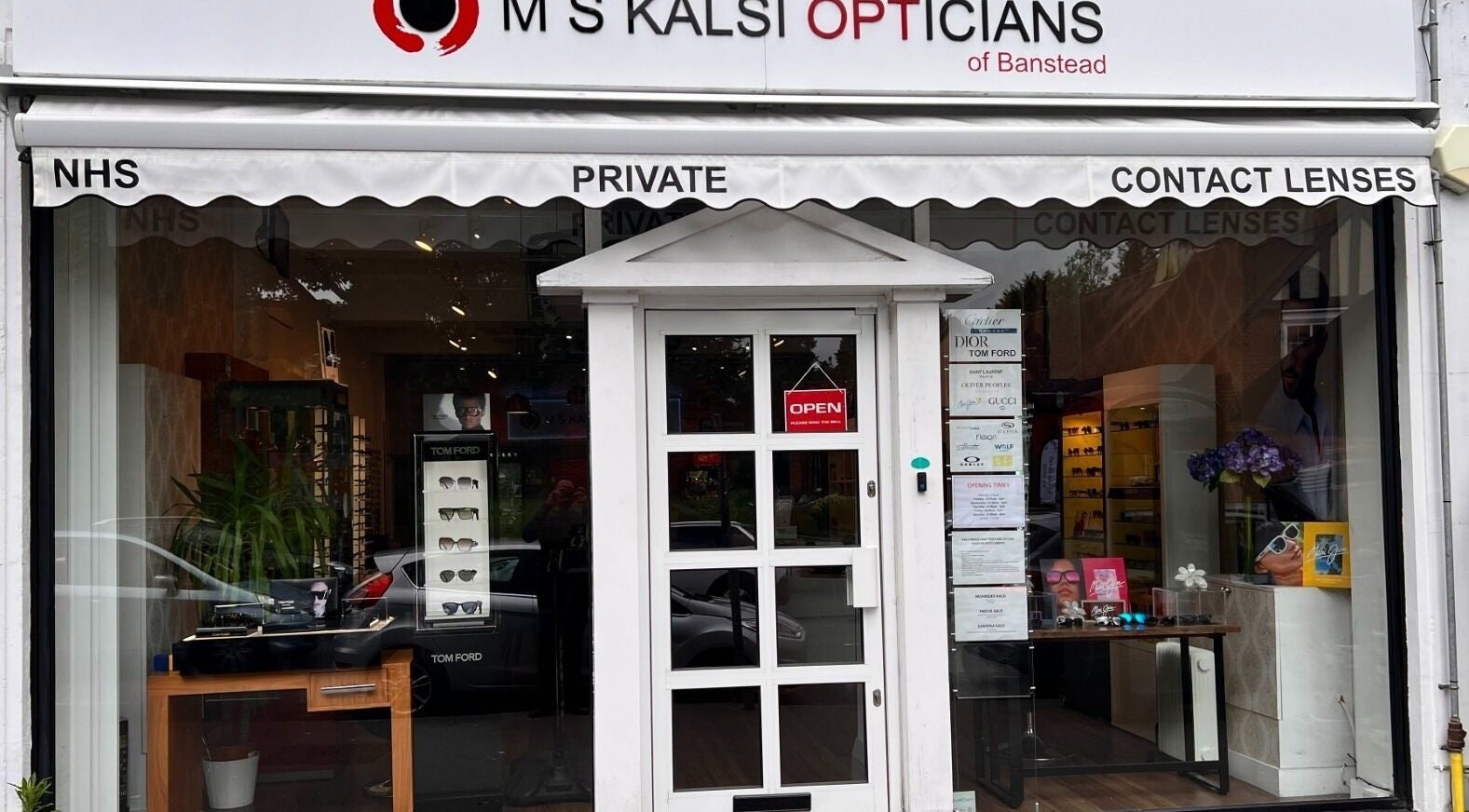 Front entrance of M S Kalsi Opticians - Banstead, showcasing eyewear displays in Banstead, GB.