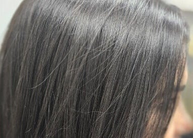 Sleek black hair at Eternal Young Salon, Calgary, Alberta, CA, showcasing professional styling.