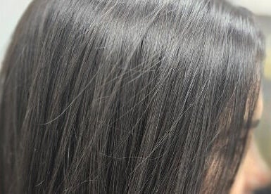 Sleek black hair at Eternal Young Salon, Calgary, Alberta, CA, showcasing professional styling.