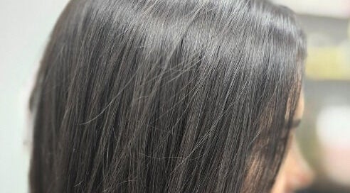 Sleek black hair at Eternal Young Salon, Calgary, Alberta, CA, showcasing professional styling.