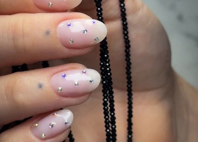 Close-up of gem-studded nails at Be Perfect Nail Studio in Oakville, Ontario, CA showcasing elegance.