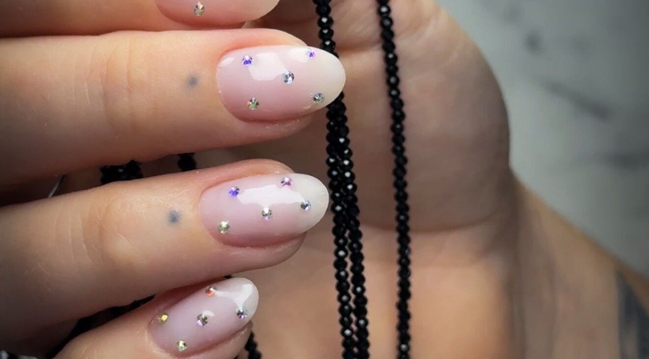 Close-up of gem-studded nails at Be Perfect Nail Studio in Oakville, Ontario, CA showcasing elegance.