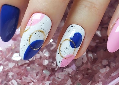 Elegant nail art with blue, pink, and gold at Be Perfect Nail Studio, Oakville, Ontario, CA.