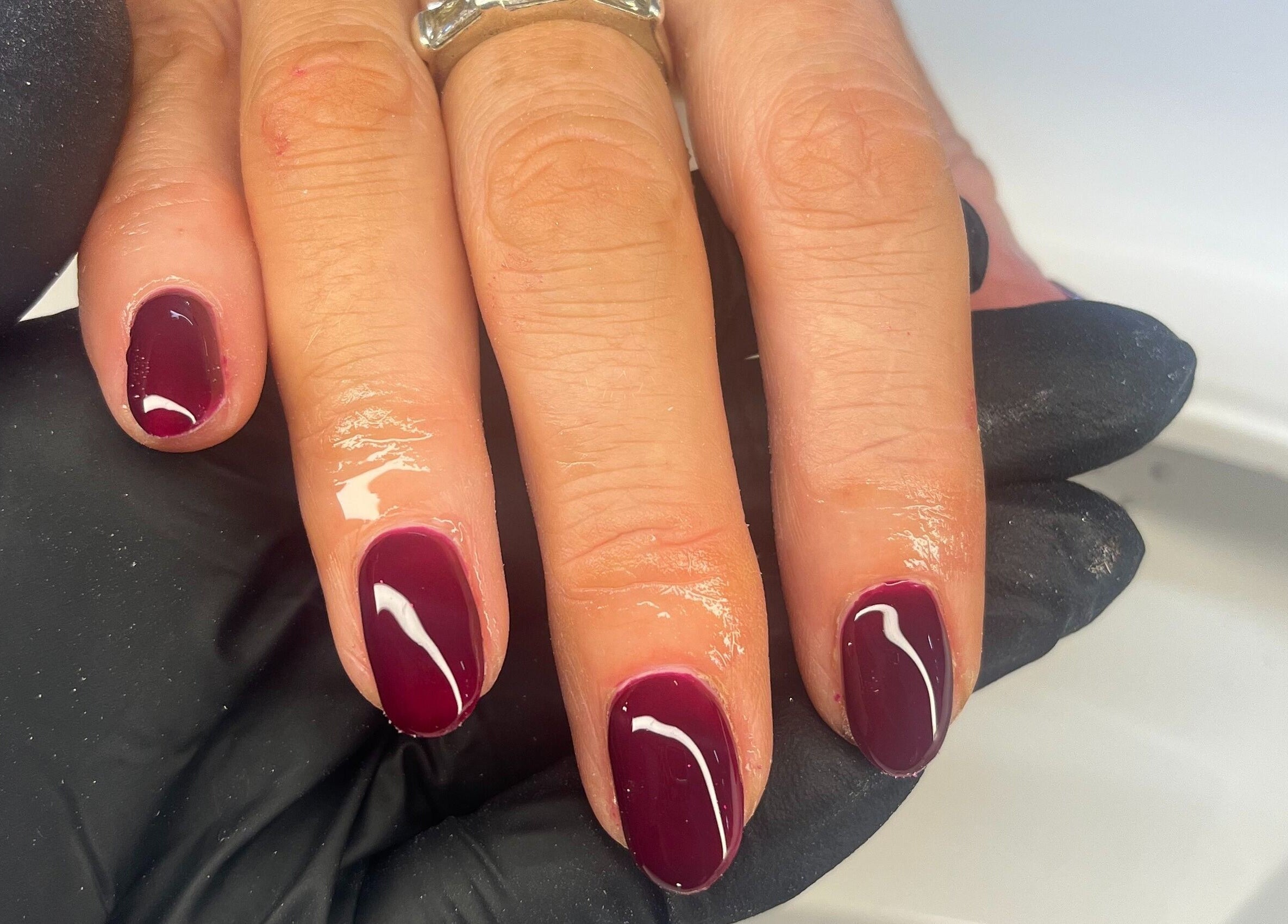 Elegant maroon manicure at Nails by Ciara Prout, Thurles, County Tipperary, IE. High-gloss finish.