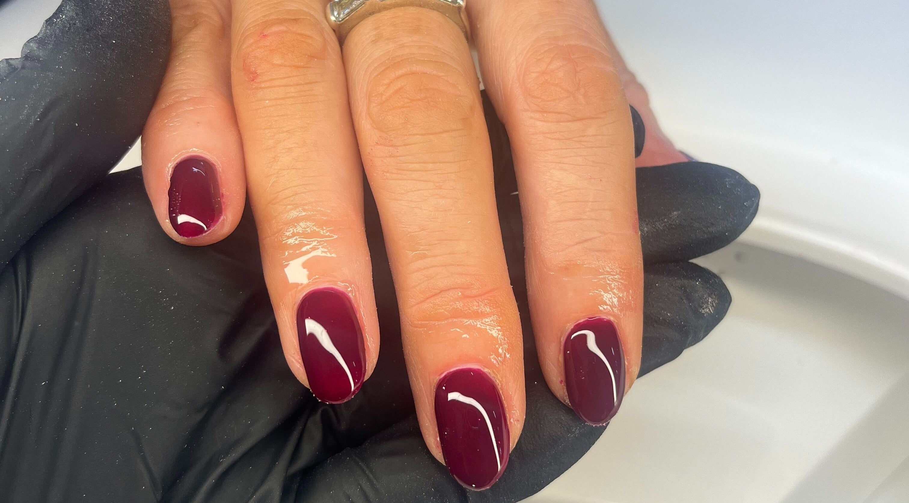 Elegant maroon manicure at Nails by Ciara Prout, Thurles, County Tipperary, IE. High-gloss finish.