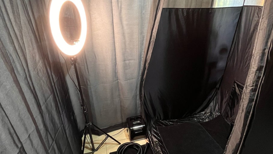 Tanning booth setup at Good Times & Tan Lines, Runaway Bay, Queensland, AU, ready for spray tan service.