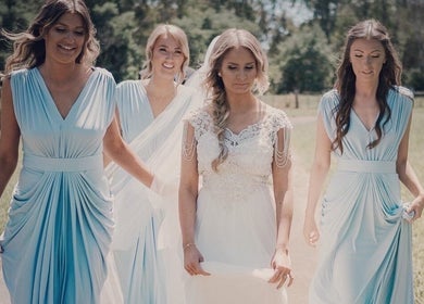 Bridesmaids and bride in elegant dresses at Good Times & Tan Lines, Runaway Bay, Queensland, AU.