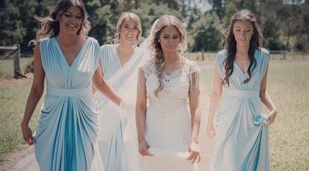 Bridesmaids and bride in elegant dresses at Good Times & Tan Lines, Runaway Bay, Queensland, AU.