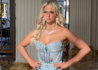 Elegant woman in shimmering dress at Good Times & Tan Lines, Runaway Bay, Queensland, AU.