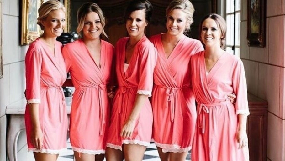 Bridesmaids in pink robes at Good Times & Tan Lines, Runaway Bay, Queensland, AU.