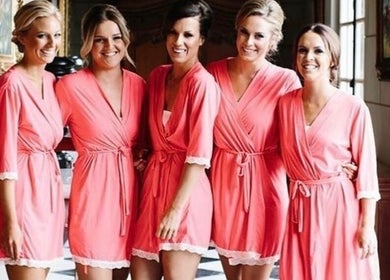 Bridesmaids in pink robes at Good Times & Tan Lines, Runaway Bay, Queensland, AU.