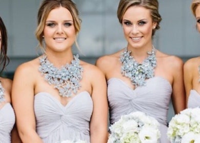 Elegant bridesmaids in matching dresses at Good Times & Tan Lines, Runaway Bay, Queensland, AU, showcasing chic style.