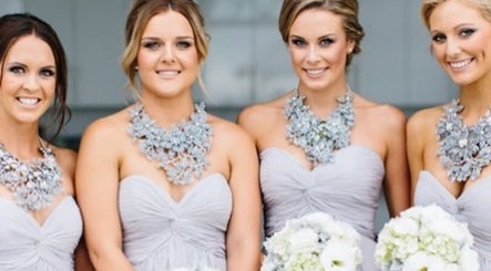 Elegant bridesmaids in matching dresses at Good Times & Tan Lines, Runaway Bay, Queensland, AU, showcasing chic style.