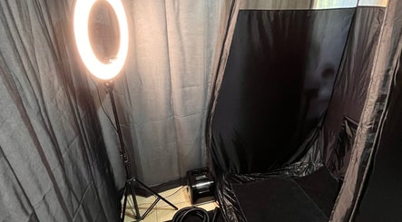 Spray tanning area at Good Times & Tan Lines, Runaway Bay, Queensland, AU, featuring professional lighting and setup.