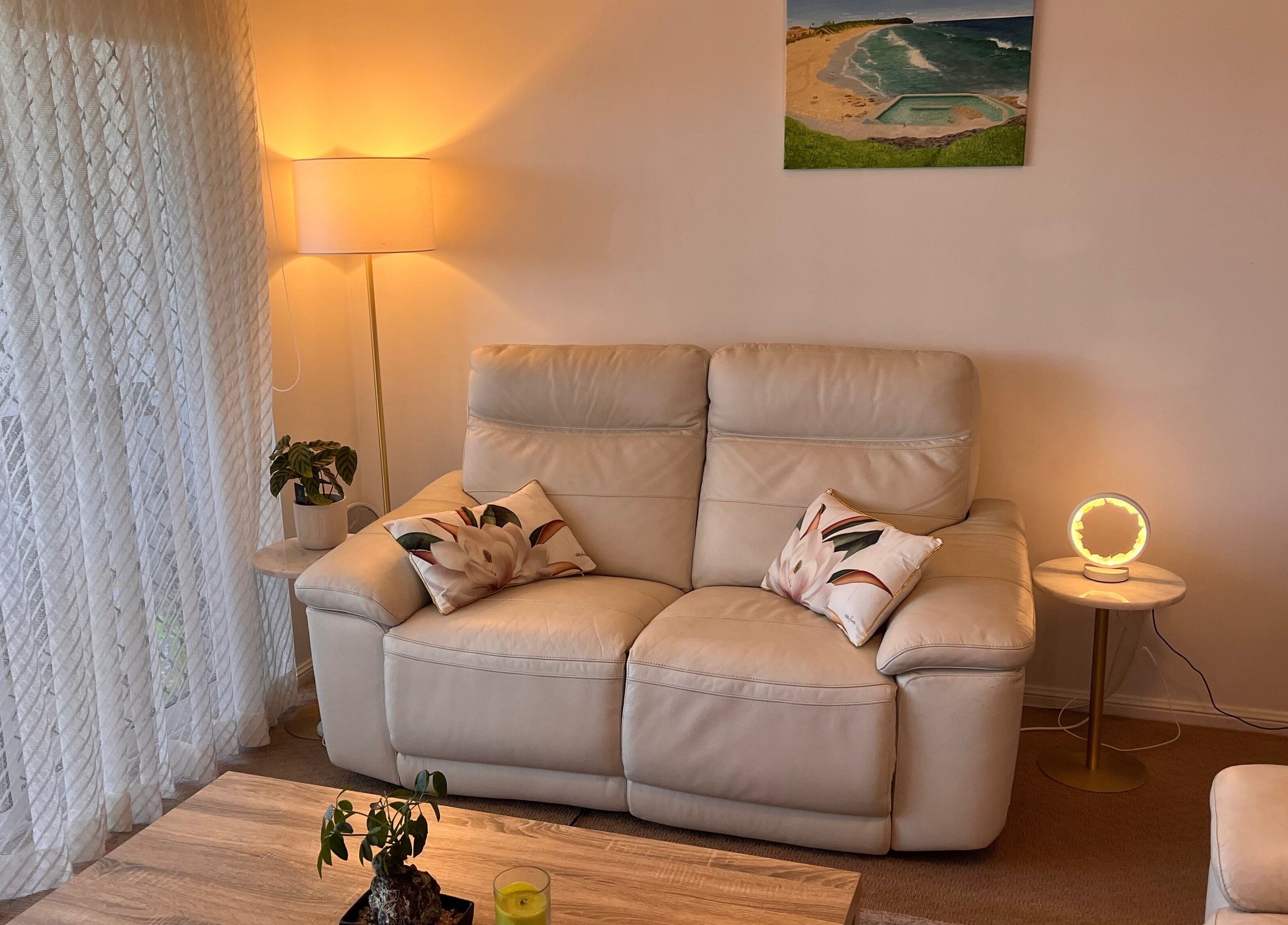 Inviting lounge at Good Times & Tan Lines, Runaway Bay, Queensland, AU with soft lighting and plush seating.