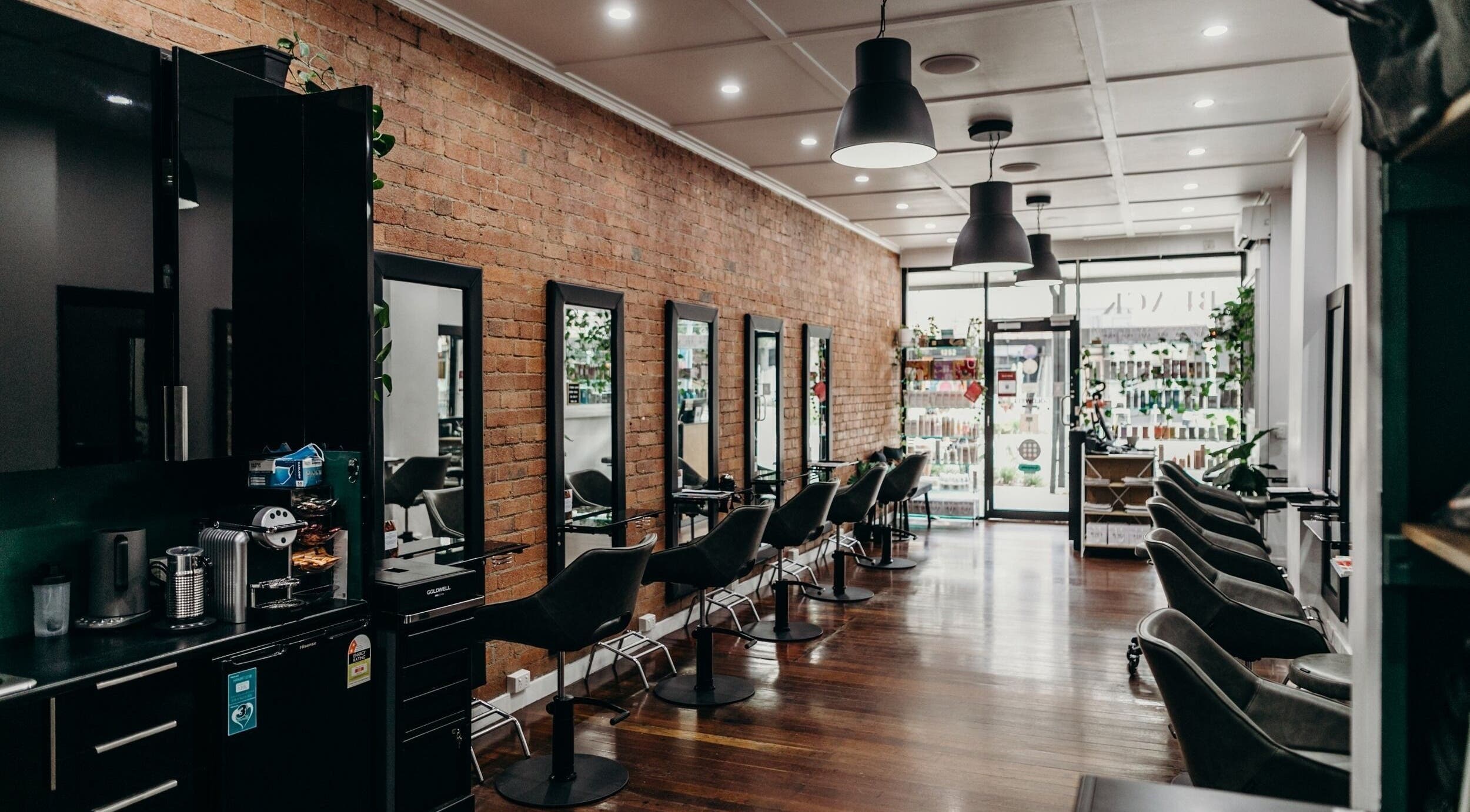 Chic hair styling stations at Black Flamingo Studio, Nundah, Queensland, AU with modern decor.