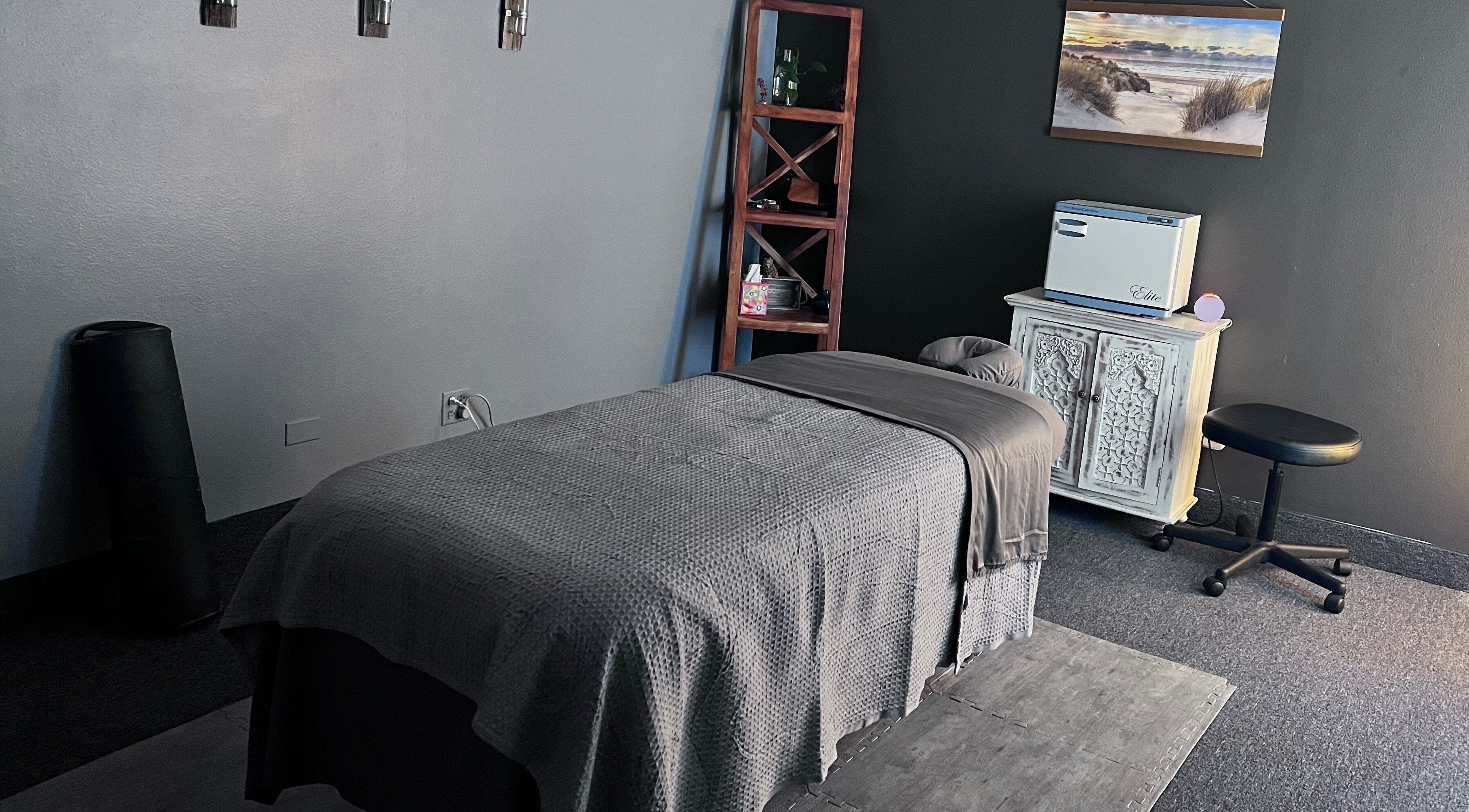Massage room at Rivers Edge Massage in Aurora, Colorado, US with a cozy table and calming decor.