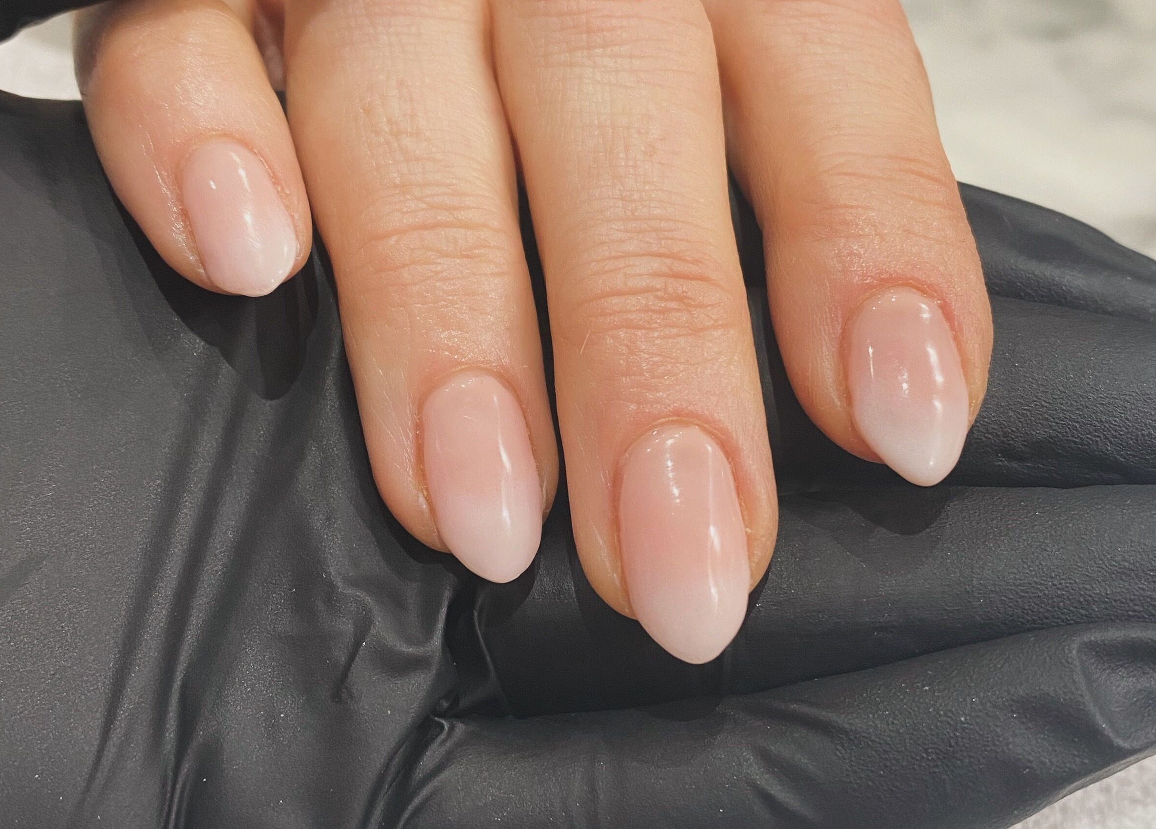 Manicured nails with elegant polish at IrreSiStible Hair & Beauty, Exeter, England, GB.