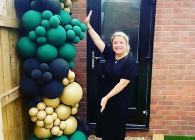 Colorful balloon display at the entrance of IrreSiStible Hair & Beauty, Exeter, England, GB.