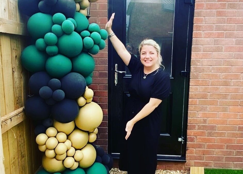 Colorful balloon display at the entrance of IrreSiStible Hair & Beauty, Exeter, England, GB.