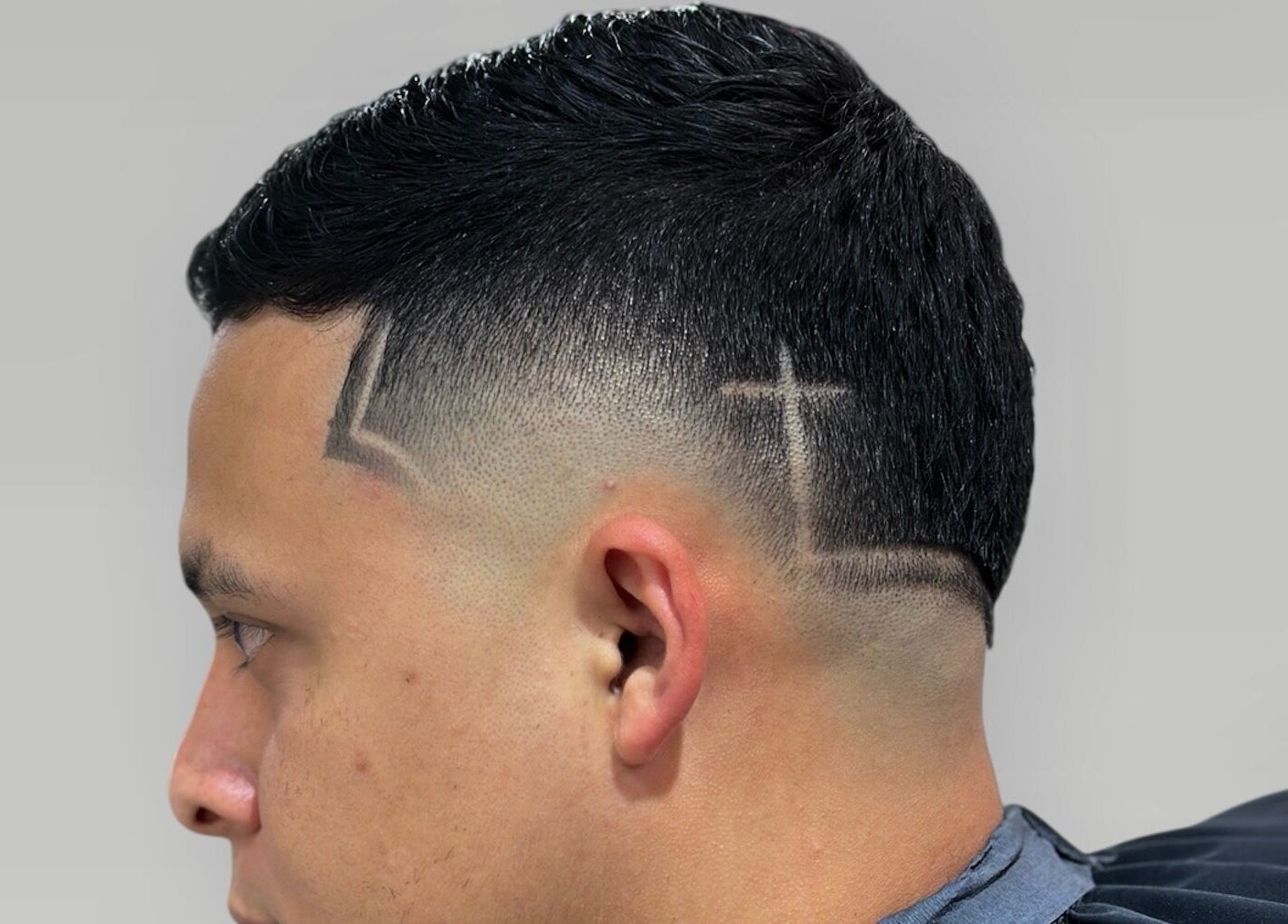 Close-up of a design haircut featuring sharp lines at Charro Barber, Montebello, California, US.