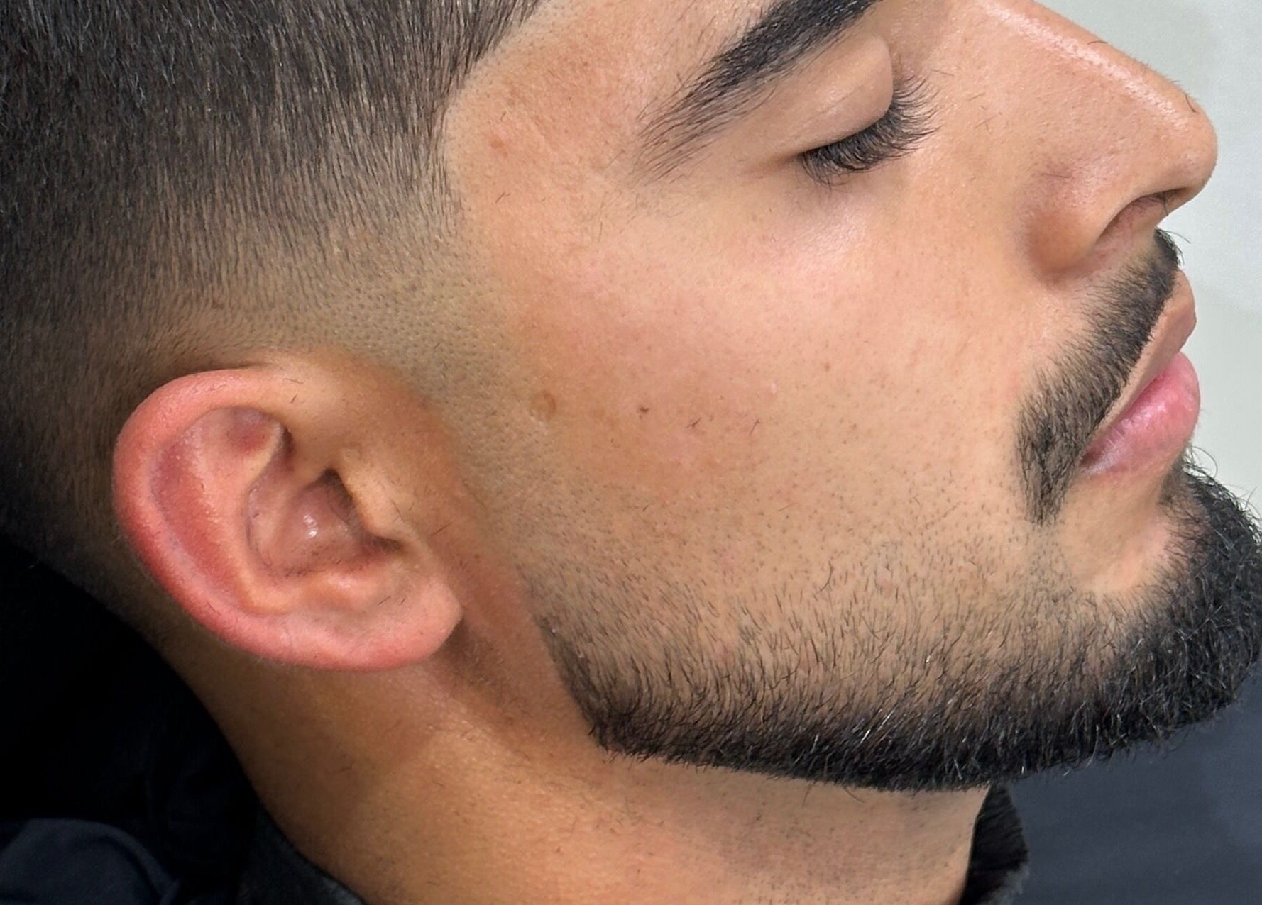 Close-up of a sharp haircut and beard trim at Charro Barber in Montebello, California, US.