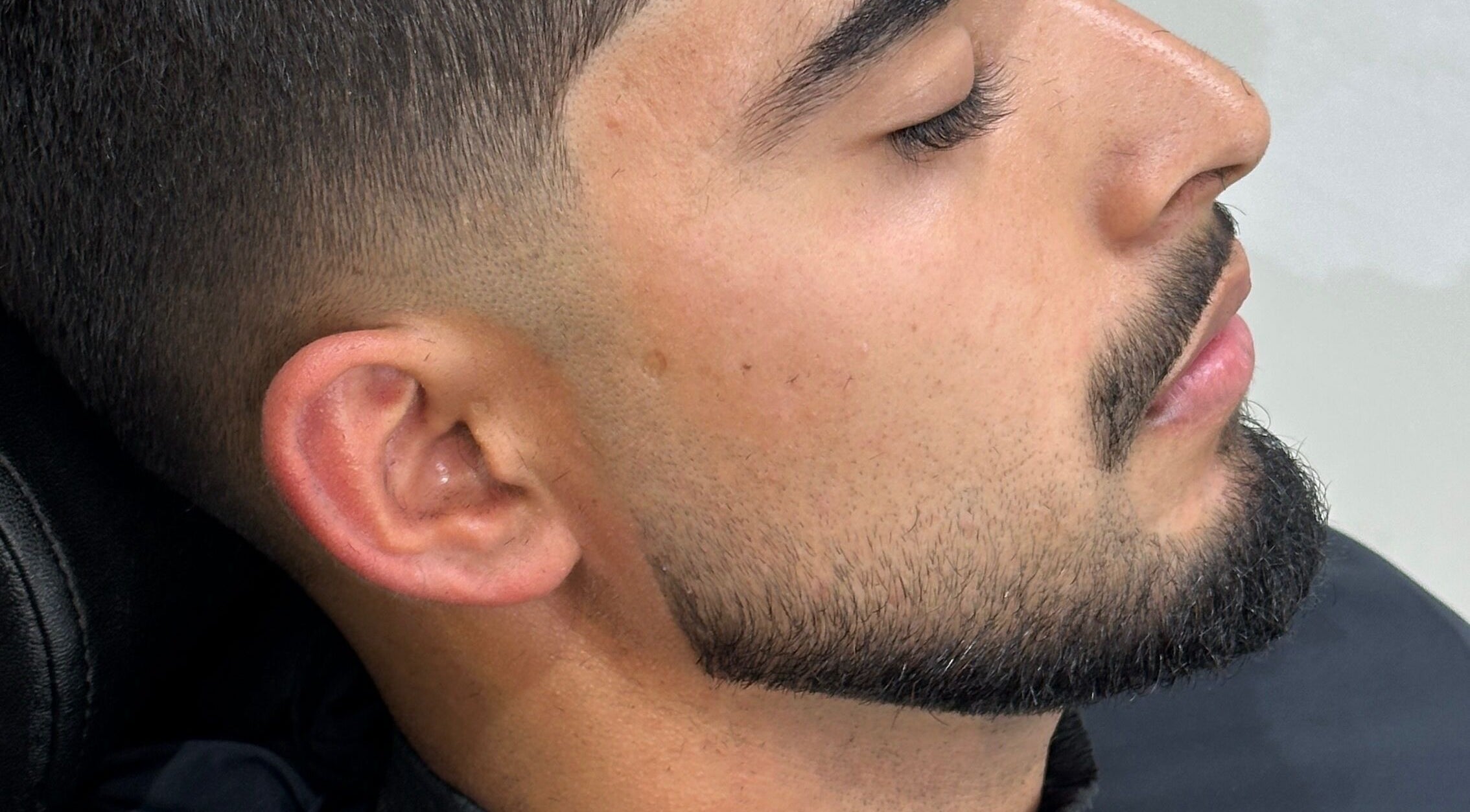 Close-up of a sharp haircut and beard trim at Charro Barber in Montebello, California, US.