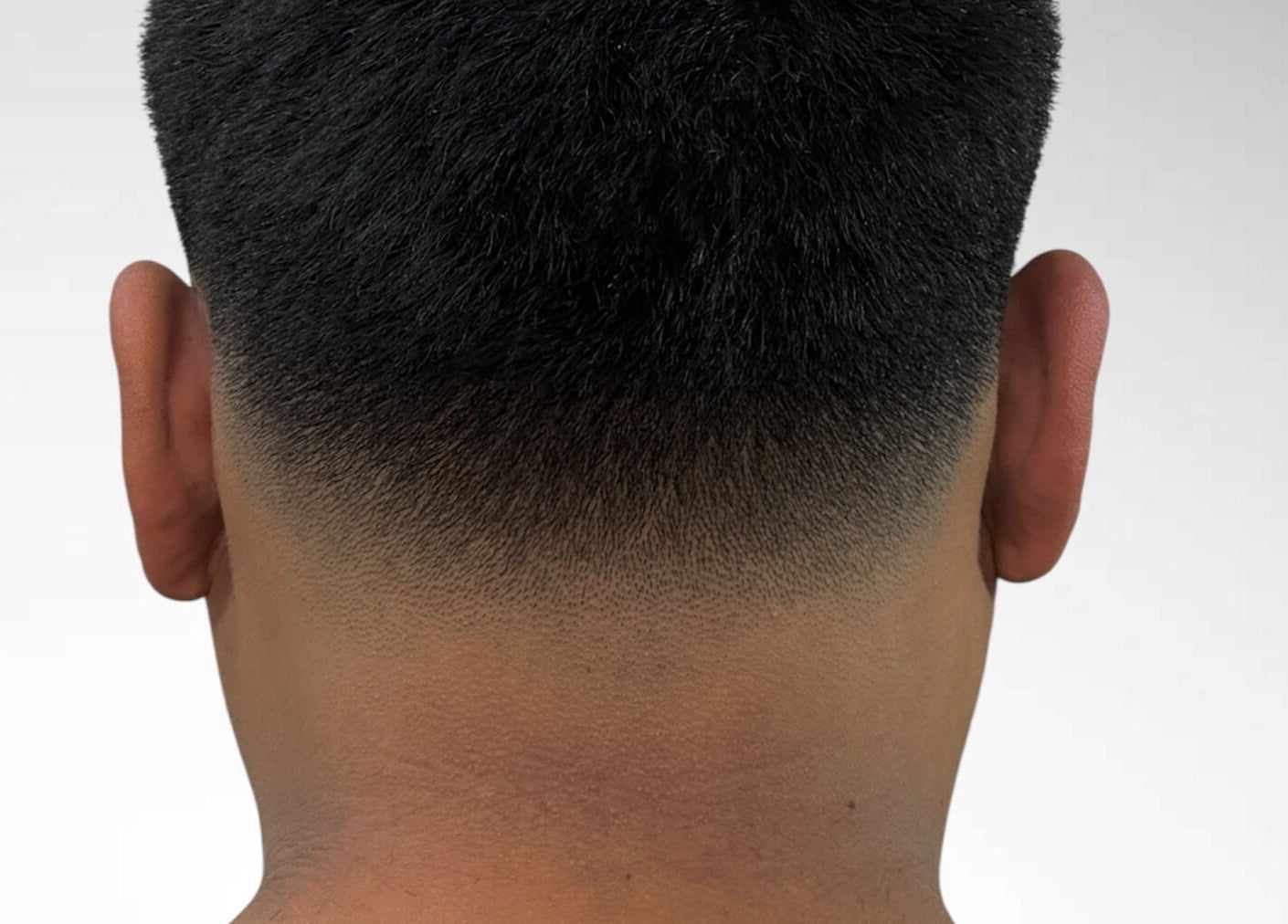 Close-up of a precise fade haircut at Charro Barber in Montebello, California, US.