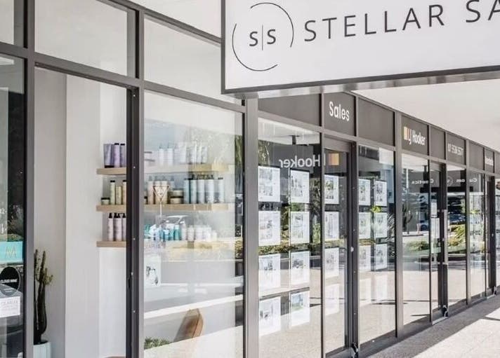 Chic exterior of Stellar Salon in Coolangatta, Queensland, AU, showcasing stylish glass windows and signage.