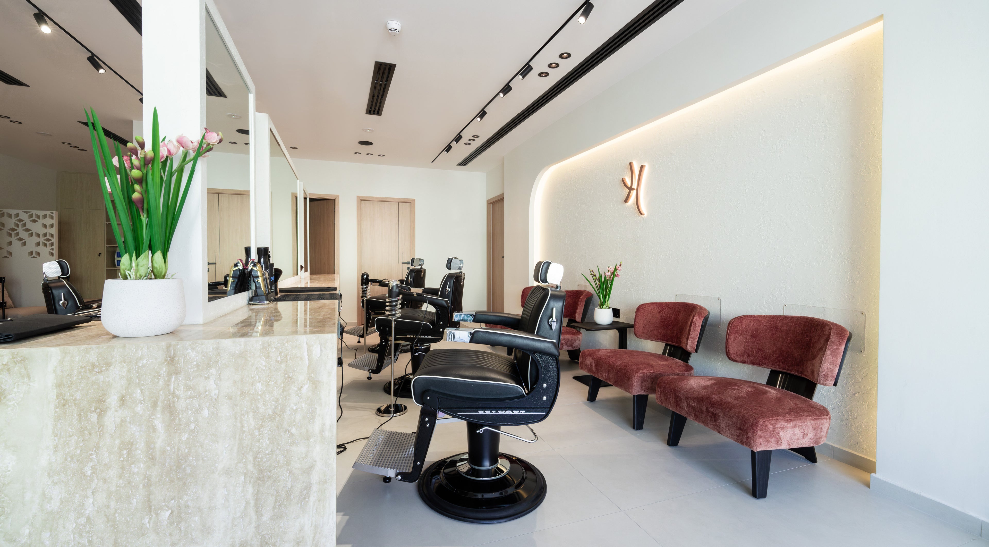 Huracan Gents barbershop in Dubai, AE features modern interiors with sleek chairs and stylish decor.