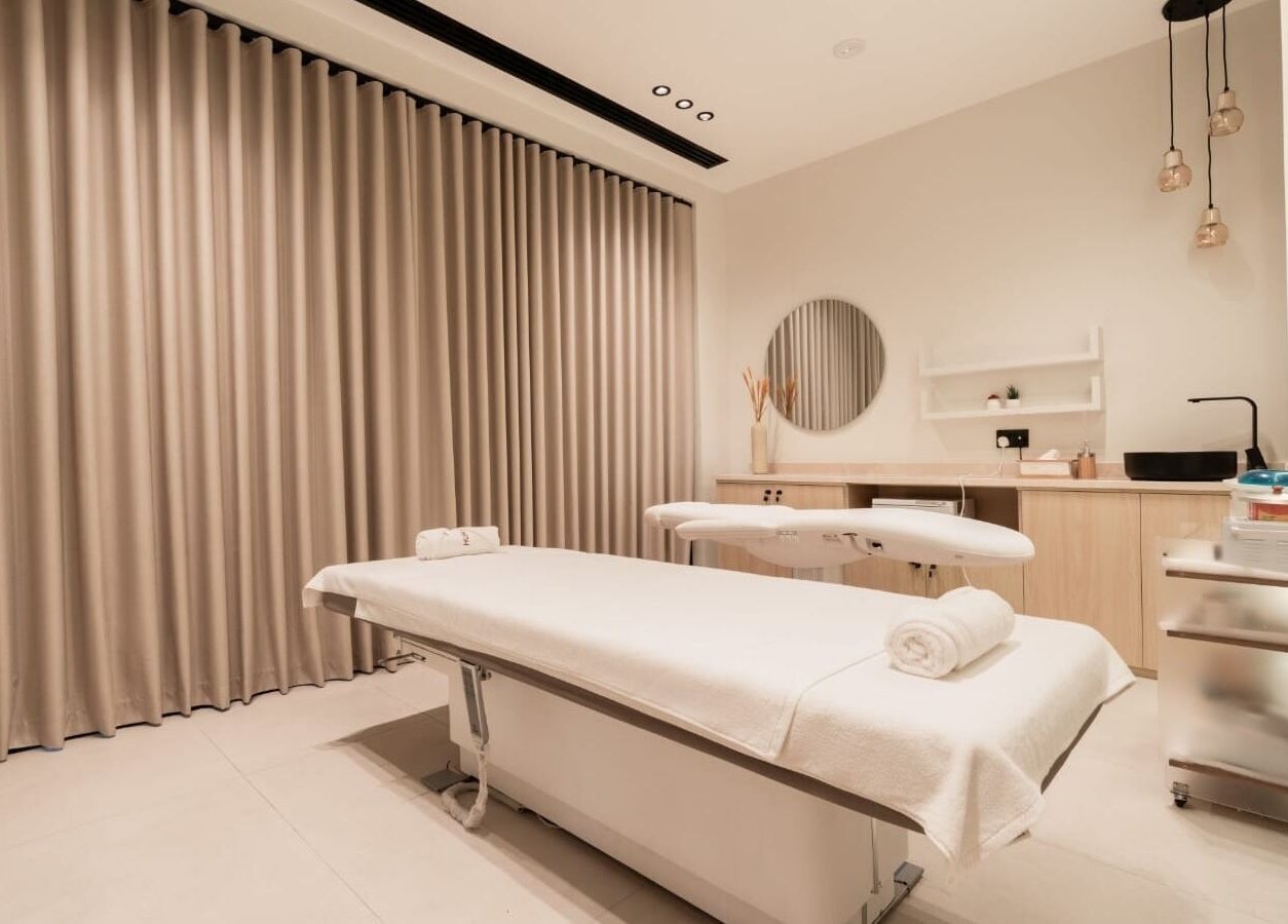 Serene spa room at Huracan By Amel - Ladies in Dubai, Dubai, AE with massage table and calming decor.