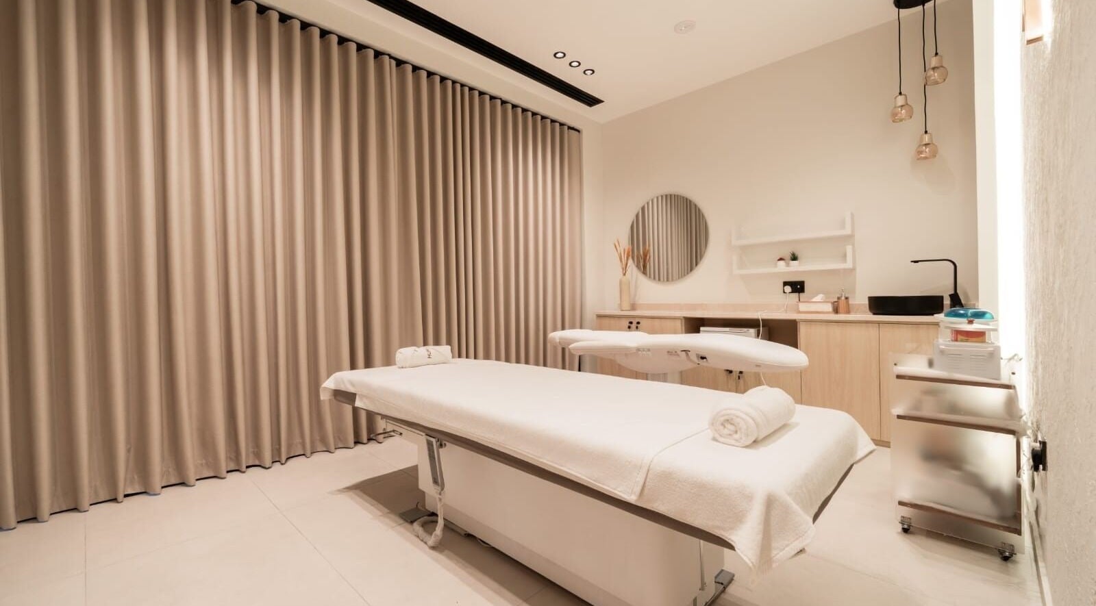 Serene spa room at Huracan By Amel - Ladies in Dubai, Dubai, AE with massage table and calming decor.