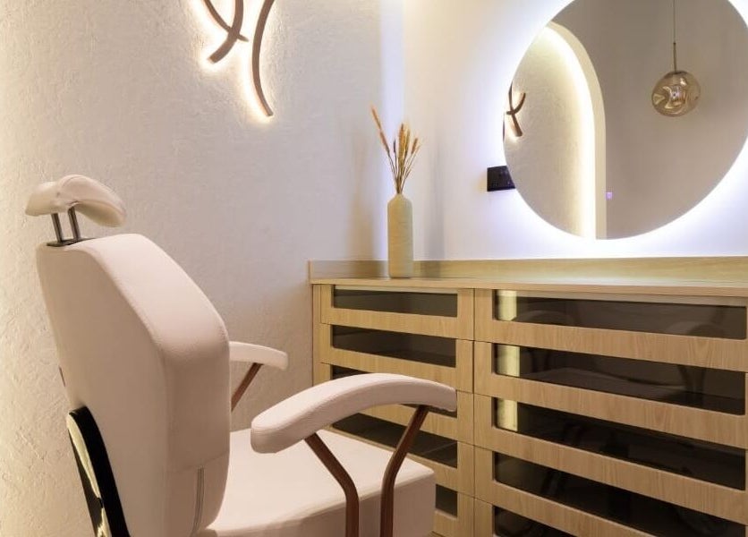 Elegant salon interior at Huracan By Amel - Ladies in Dubai, Dubai, AE, with plush chair and modern lighting.
