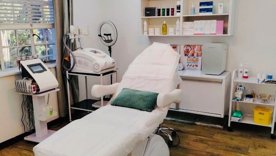 Relaxing treatment room at MANONO Aesthetics and Wellness Clinic, Johannesburg, Gauteng, ZA, highlighting spa amenities.