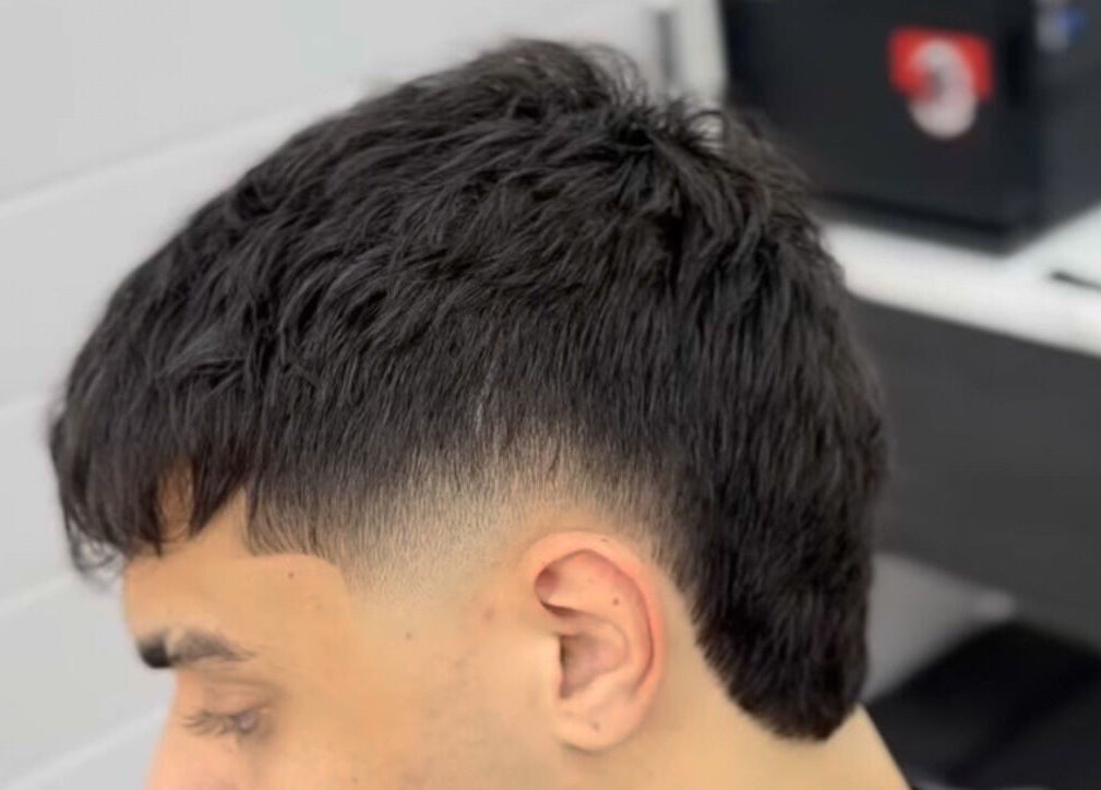 Close-up of a trendy haircut at Matteo Cau, Croydon, South Australia, AU, showcasing precision styling.