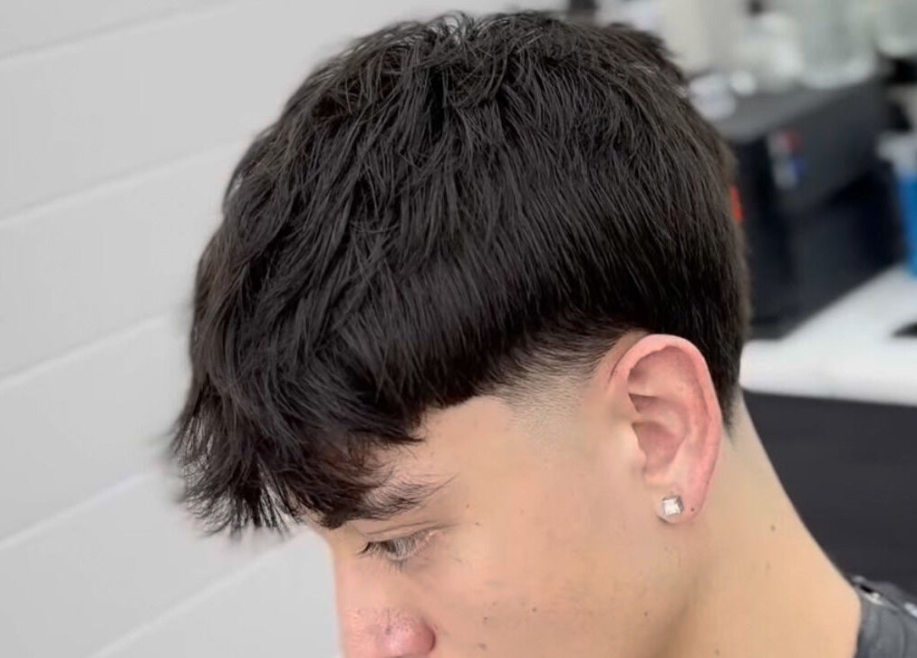 Modern haircut at Matteo Cau in Croydon, South Australia, AU, showcasing precise styling and detail.