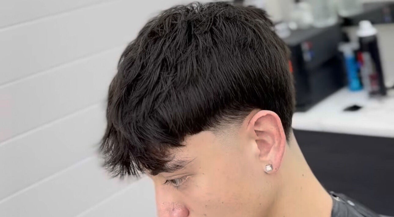 Modern haircut at Matteo Cau in Croydon, South Australia, AU, showcasing precise styling and detail.