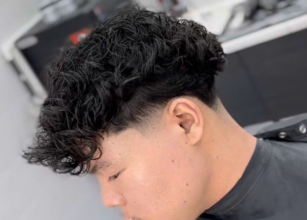 Stylish curly fade haircut at Matteo Cau, Croydon, South Australia, AU.
