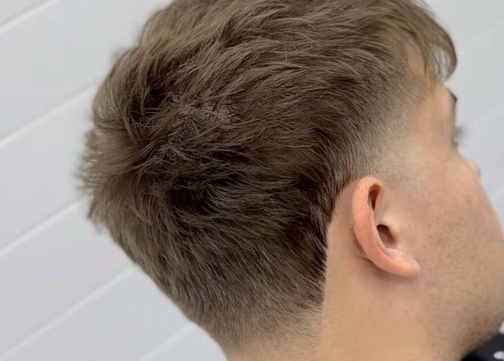 Close-up of a stylish fade haircut at Matteo Cau, Croydon, South Australia, AU.