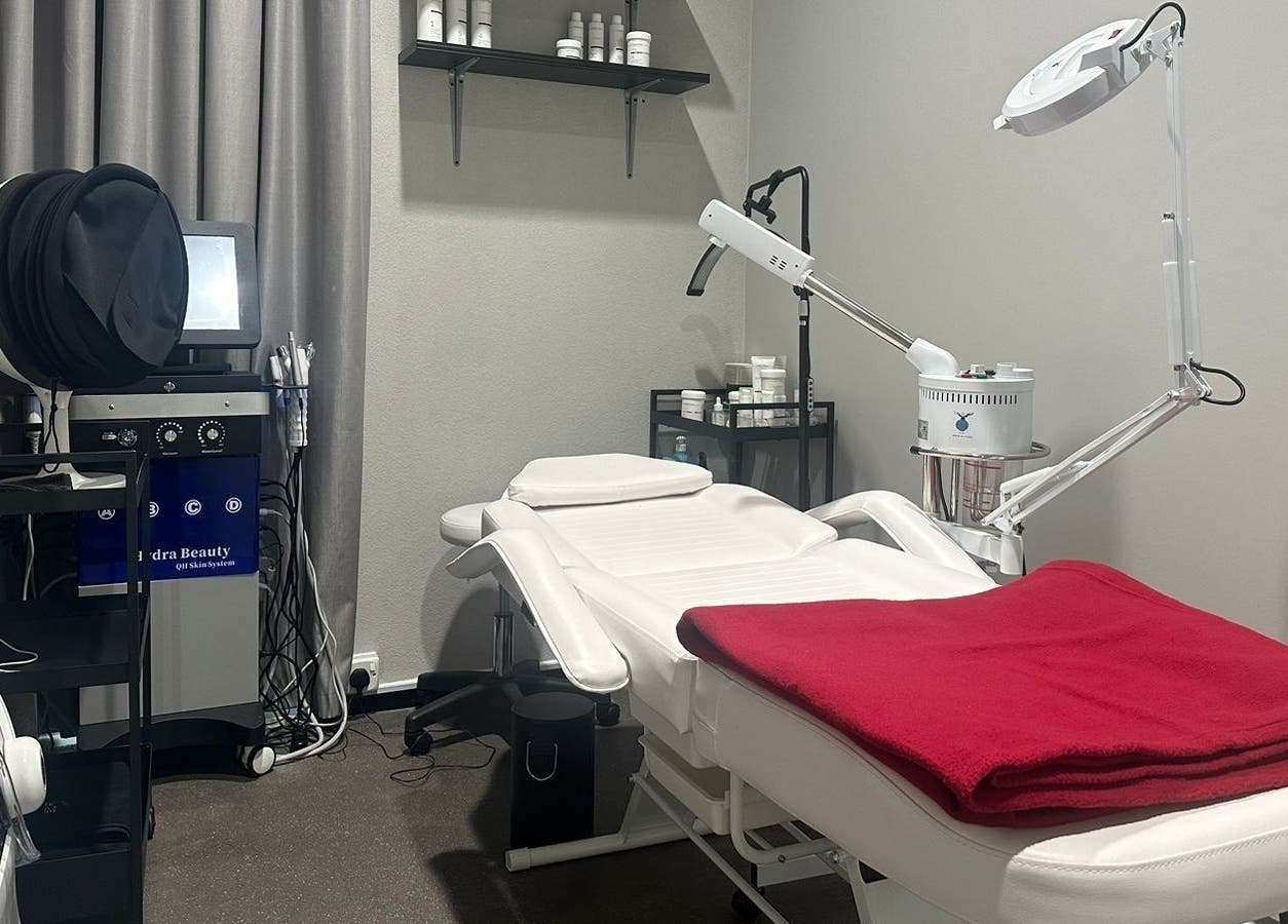 Modern treatment room at My Face, Riyadh, Riyadh Province, SA, featuring a spa bed and skincare equipment.